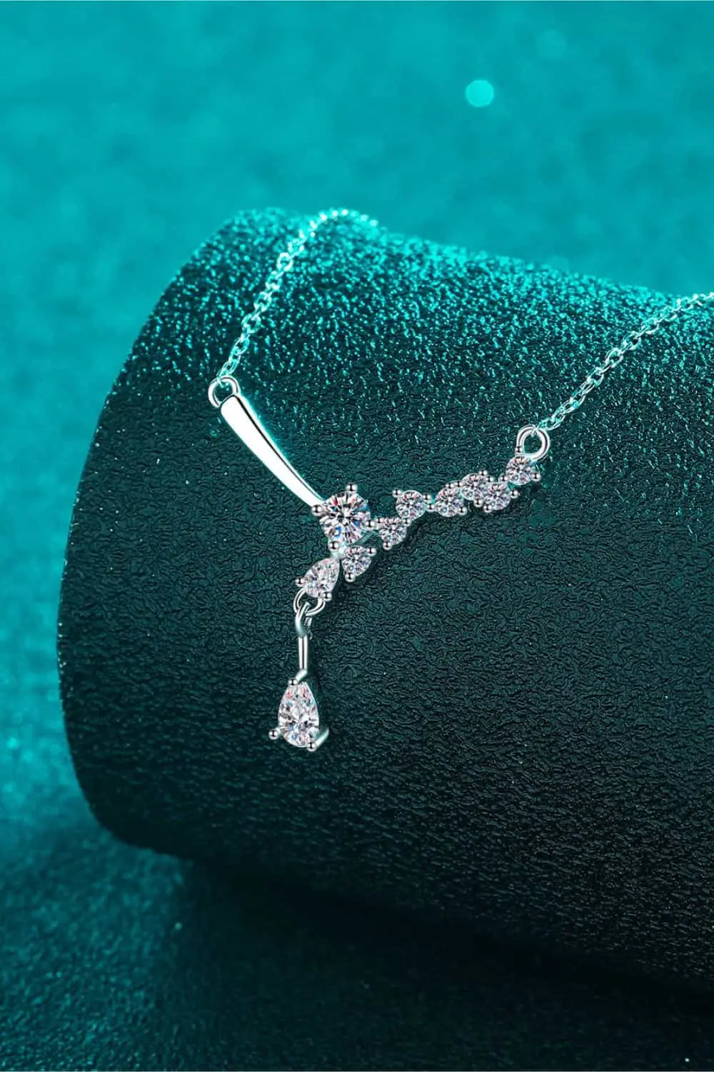925 sterling silver necklace with a delicate floral-inspired design featuring Carat Moissanite stones and a dangling teardrop gem