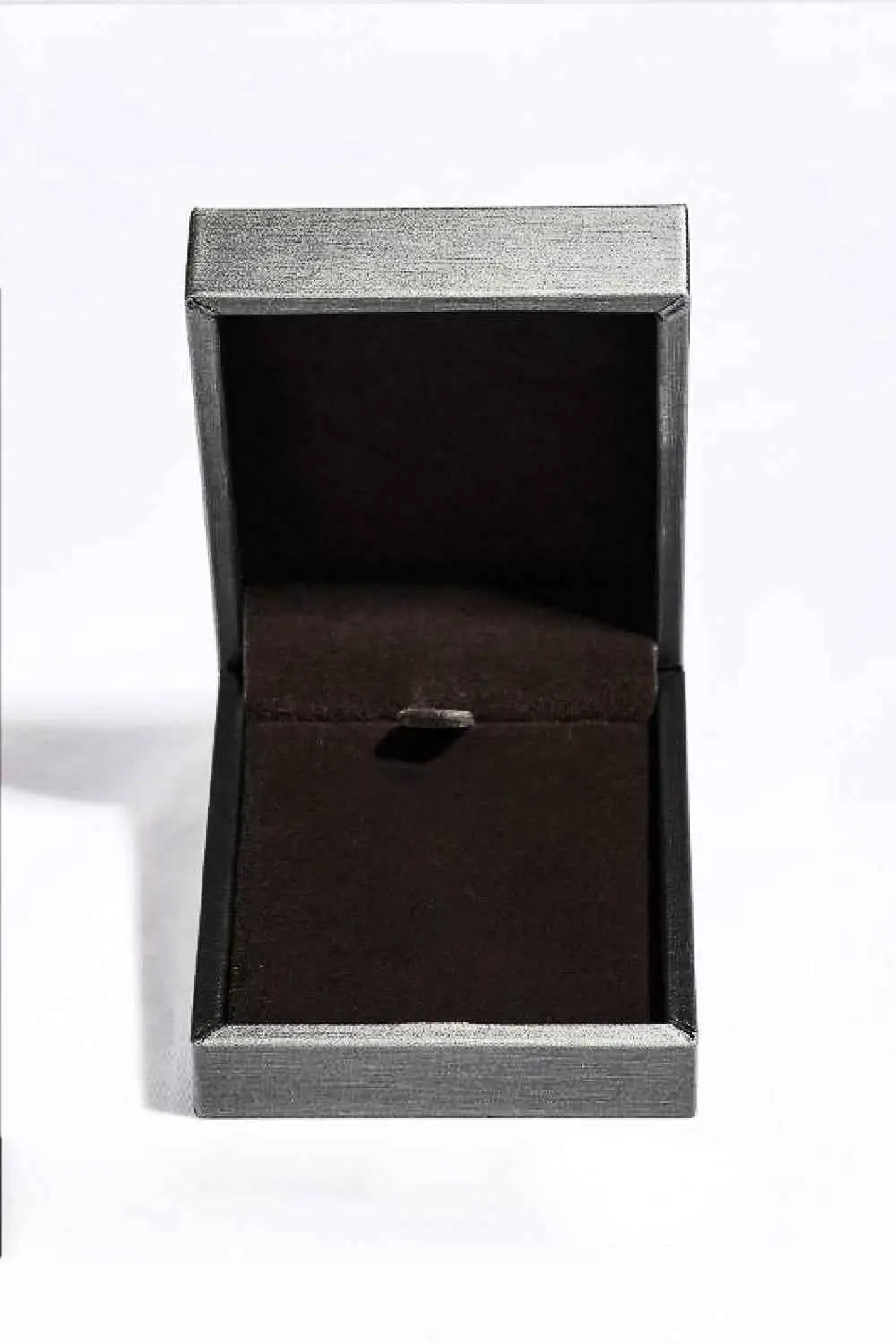 Empty grey and black jewelry box with a dark velvet interior and a small holder for a pendant