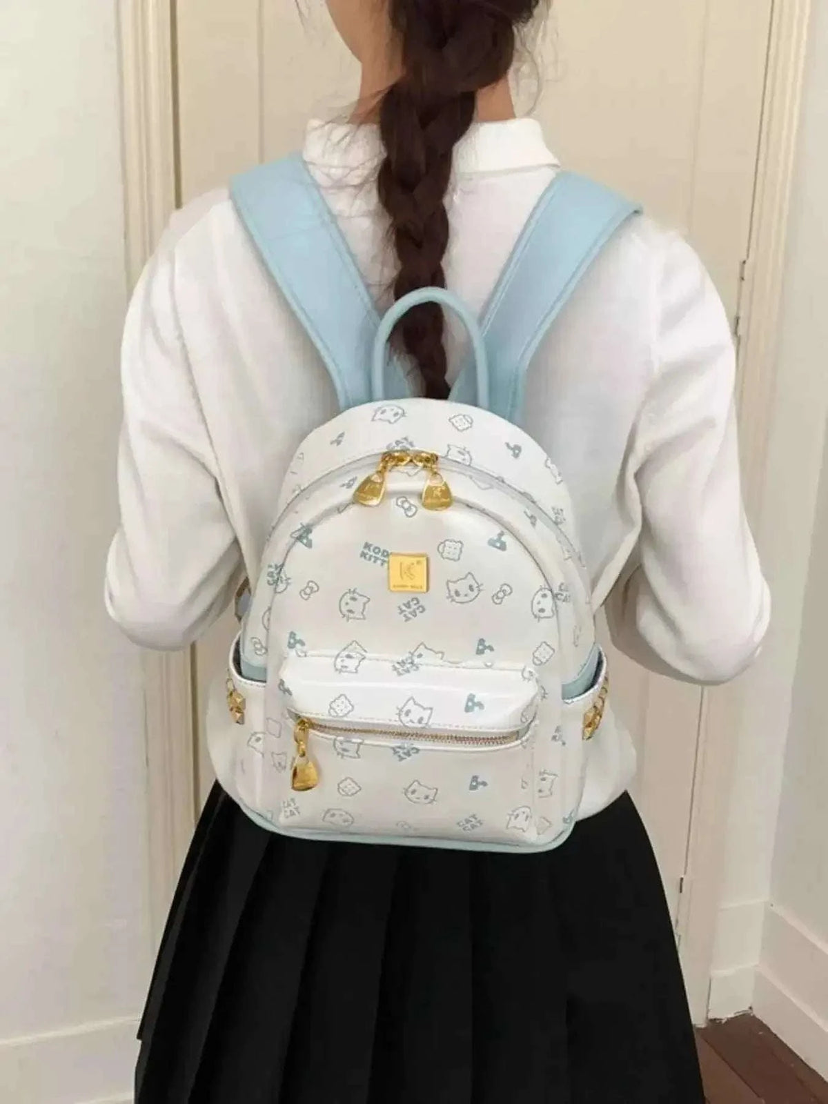 Mini Cartoon Pattern Backpack in white PU leather featuring light blue bear and star prints with gold zipper and bear pendant