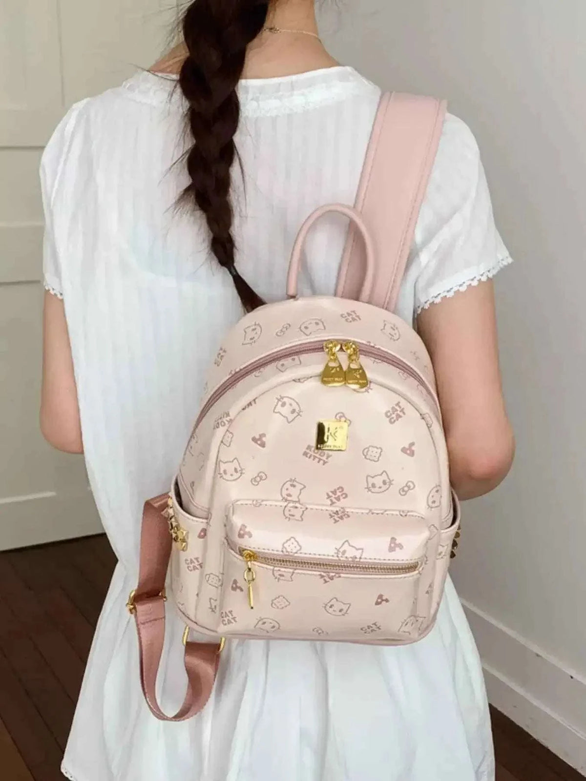Cartoon Pattern Backpack in light pink PU leather with animal and food motifs, gold-tone bear pendant and zipper details