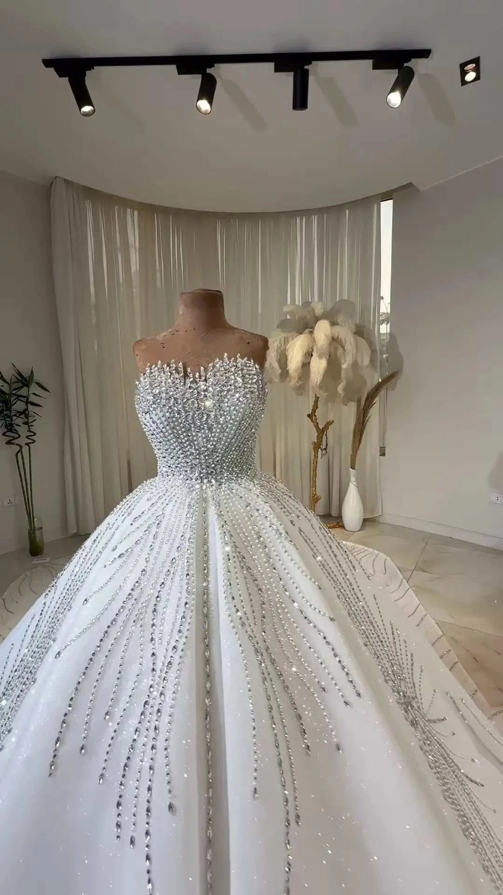 Celeste Crystal Ball Gown elegant white strapless ball gown with intricate crystal bead embellishments and a voluminous skirt
