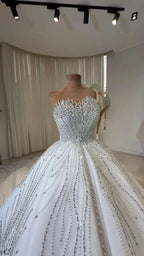 Celeste Crystal Ball Gown white ball gown wedding dress adorned with intricate crystal beadwork and fitted bodice