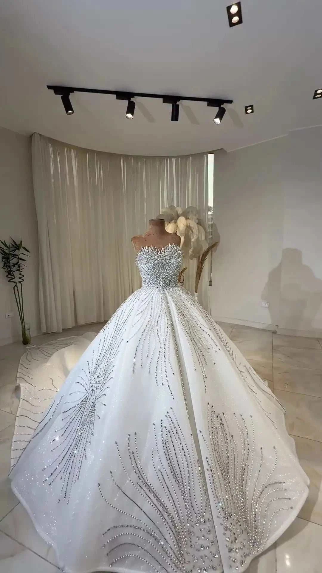 Celeste Crystal Ball Gown elegant white off-the-shoulder ball gown bridal dress with intricate crystal and bead embellishments and lace detailing