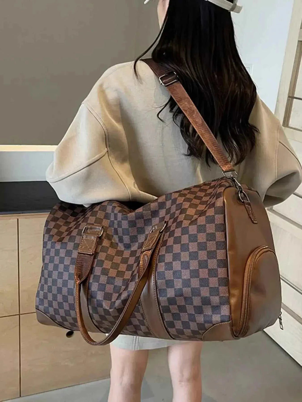 Large Checkered Pattern Travel Bag in brown and dark brown PU leather with a checkered print, carrying handles, and shoulder strap
