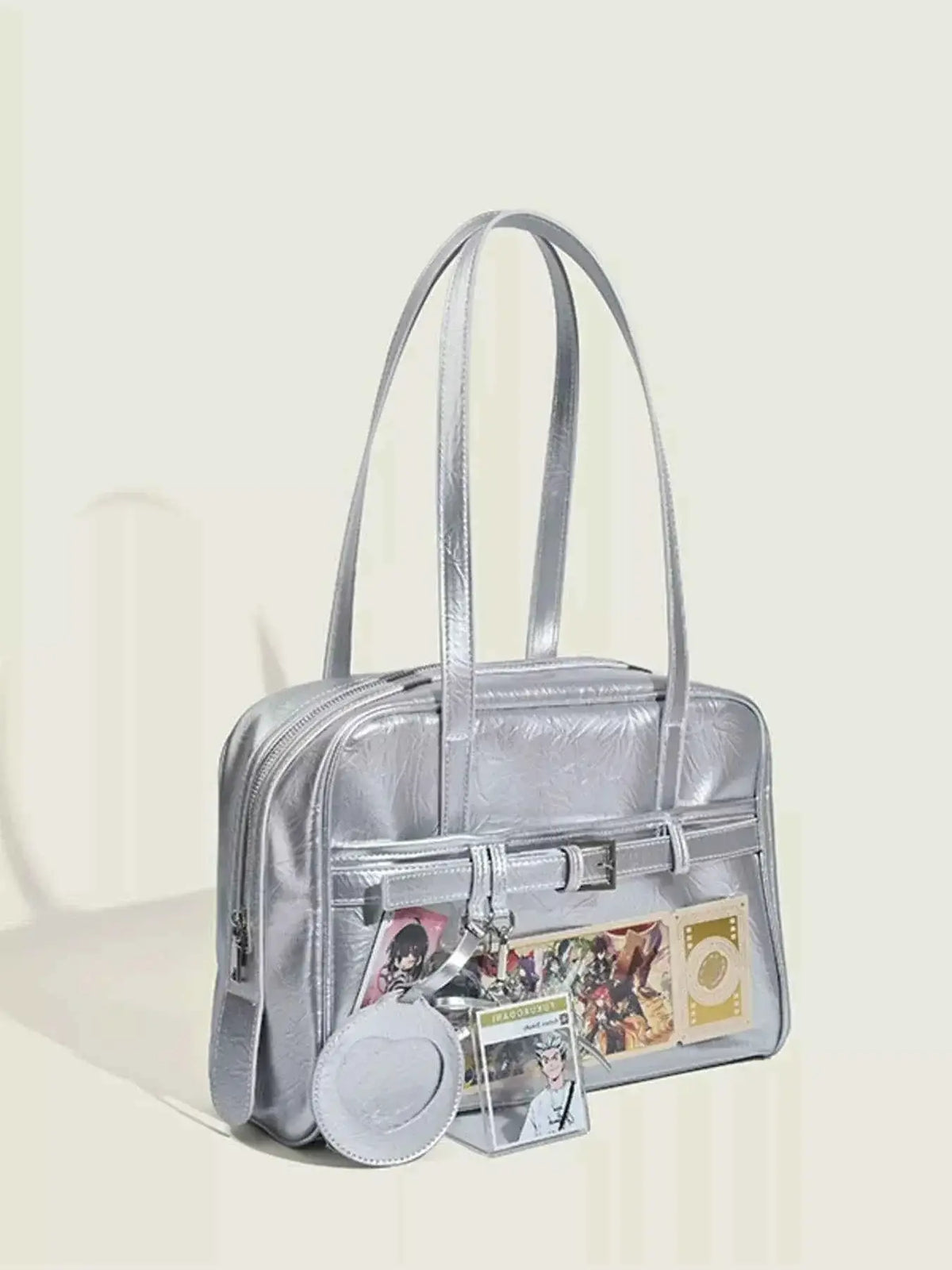 Clear Window Shoulder Bag in metallic silver PU leather with a transparent front pocket and adjustable straps.