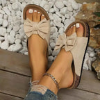 Beige Comfortable Bow Decor casual sandals with large fabric bow accents, suede texture, and flat rubber soles