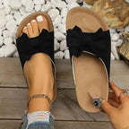 Comfortable Bow Decor casual sandals with black polyester upper bow design and beige rubber sole flats worn on foot