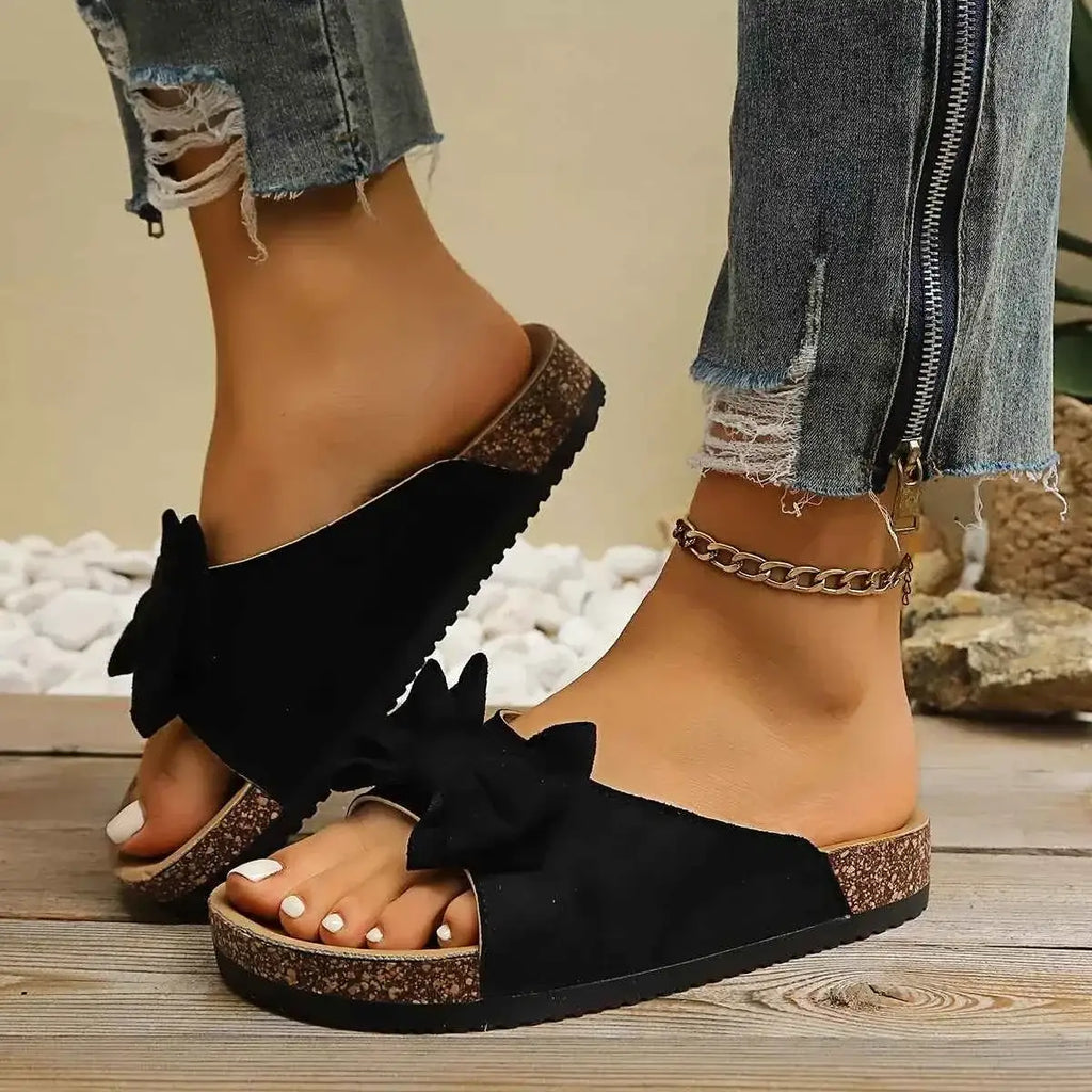 Comfortable Bow Decor casual black polyester and rubber flat sandals with oversized bow detail and cork-textured sole