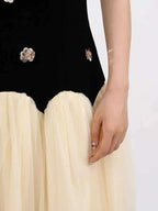 Contrast Flower Sleeveless black and cream sleeveless tulle maxi dress with floral embellishments and ruched detailing