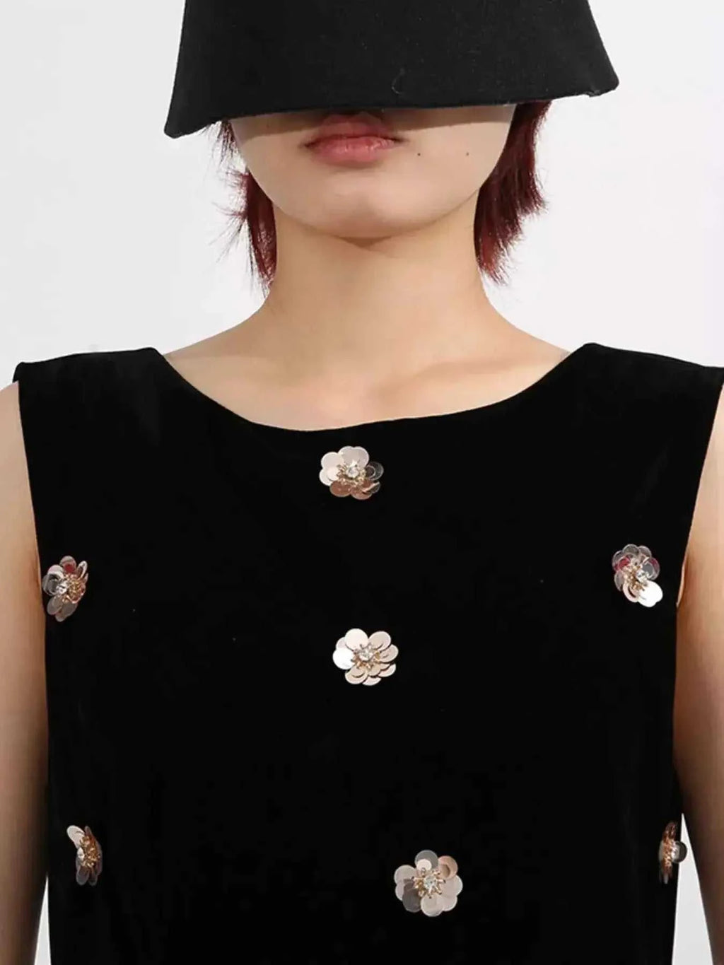 Contrast Flower Sleeveless black tulle dress with metallic floral embellishments and sleeveless design
