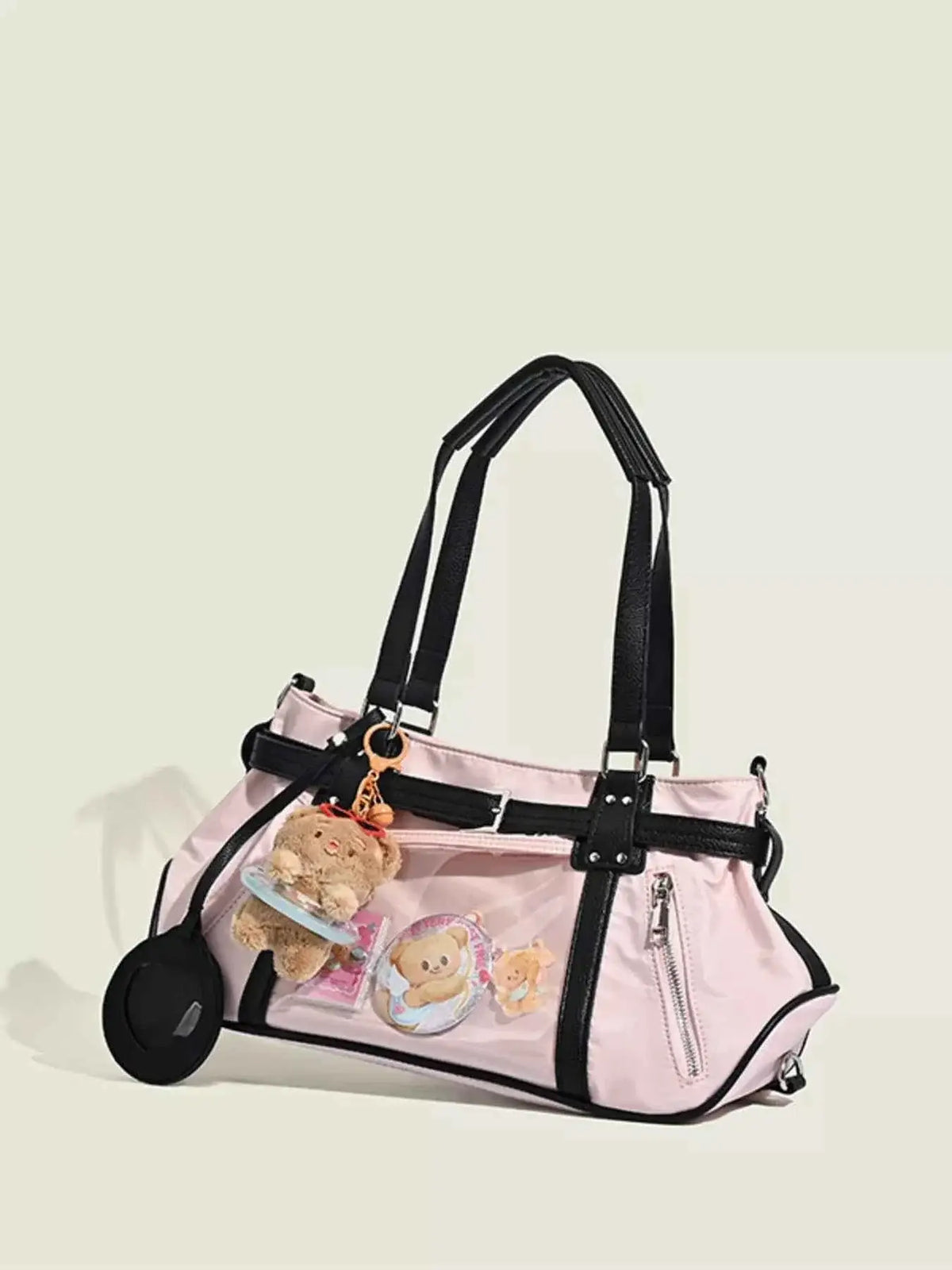 Contrast Lightweight Shoulder Bag in light pink PU leather with black trim, clear pocket, and teddy bear keychain charm