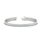 Created Moissanite half bezel tennis bracelet in 14K white gold over sterling silver with princess cut stones