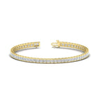 Created Moissanite princess cut tennis bracelet in 14K yellow gold over sterling silver with half bezel setting and sparkling stones