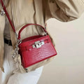 Crocodile-Embossed mini top-handle handbag in red PU leather with silver-tone hardware and detachable shoulder strap