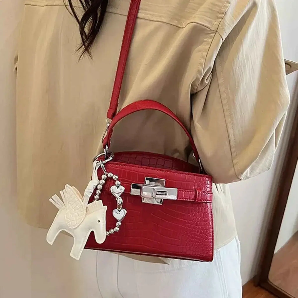 Crocodile-Embossed mini top-handle handbag in red PU leather with silver clasp and white horse charm accessory