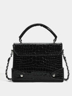 Small black PU leather crossbody bag with Crocodile Pattern Flap texture and a top handle with chain strap