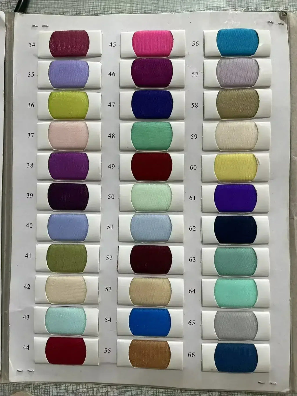 Color swatches of lace fabric in various shades including red, pink, blue, purple, green, and beige for Custom High Neck Ball Gown