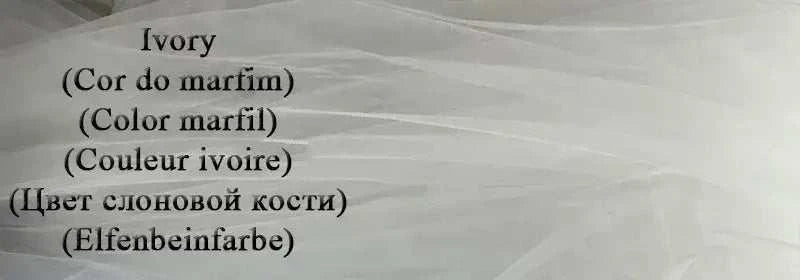 Customized Wedding Dress symbol on sheer ivory tulle fabric with delicate soft folds in various languages