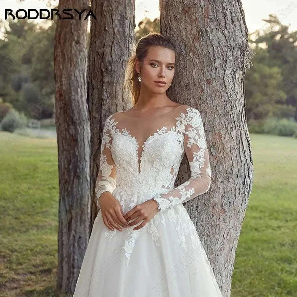 Customized Wedding Dress white polyester with long sheer lace sleeves, illusion scoop neckline, applique floral details and A-line tulle skirt