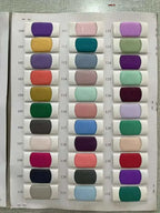 Fabric swatch chart with 33 color samples including purple, mustard, green, pink, and blue shades for Customized Wedding Dresses fabrication.
