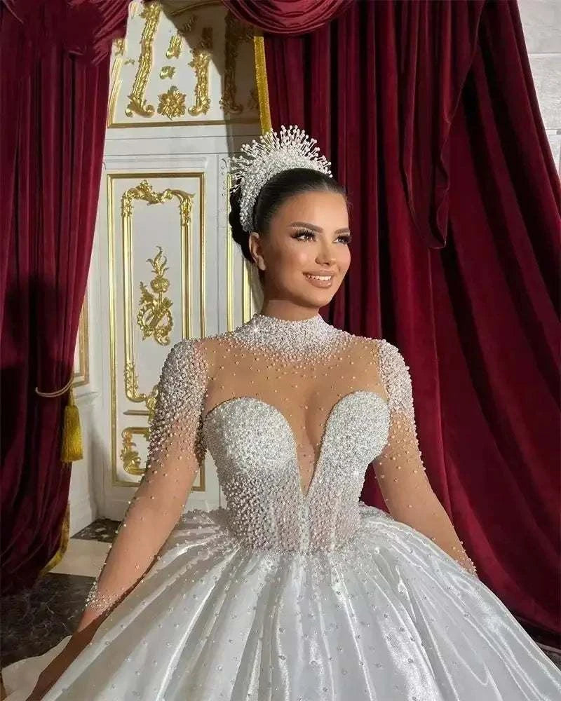 White Customized Wedding Dresses ball gown with long sheer sleeves, high neck, and pearl embellishments with crown