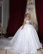 Customized Wedding Dresses white satin ball gown with high neck, long sleeves, pearl embellishments, and chapel train
