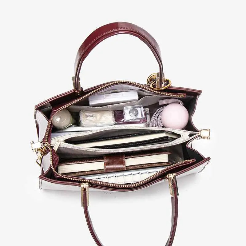 Detachable Strap Crossbody Bag in burgundy PU leather with gold hardware, showing organized multiple compartments and handles