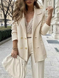 Double-Breasted Textured Jacket in cream beige with ribbed knit pattern, gold buttons, and lapel collar styled with white pants and clutch