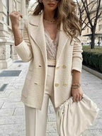 Double-Breasted Textured Jacket in cream with ribbed pattern, double-breasted gold buttons, and a tailored fit worn by a woman
