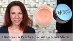 Peachy rose-colored waterproof multi-tasking creme-to-powder lip color in clear jar with black lid labeled mommy make up