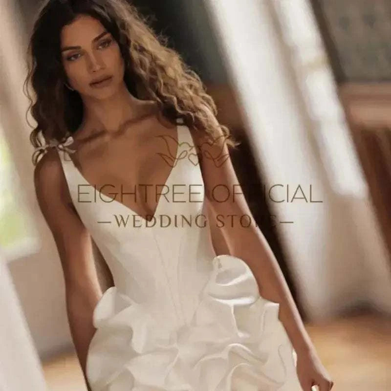 Eightree Fashion Short Wedding Dresses sleeveless white satin mini bridal dress with deep V-neck and ruffled skirt detail