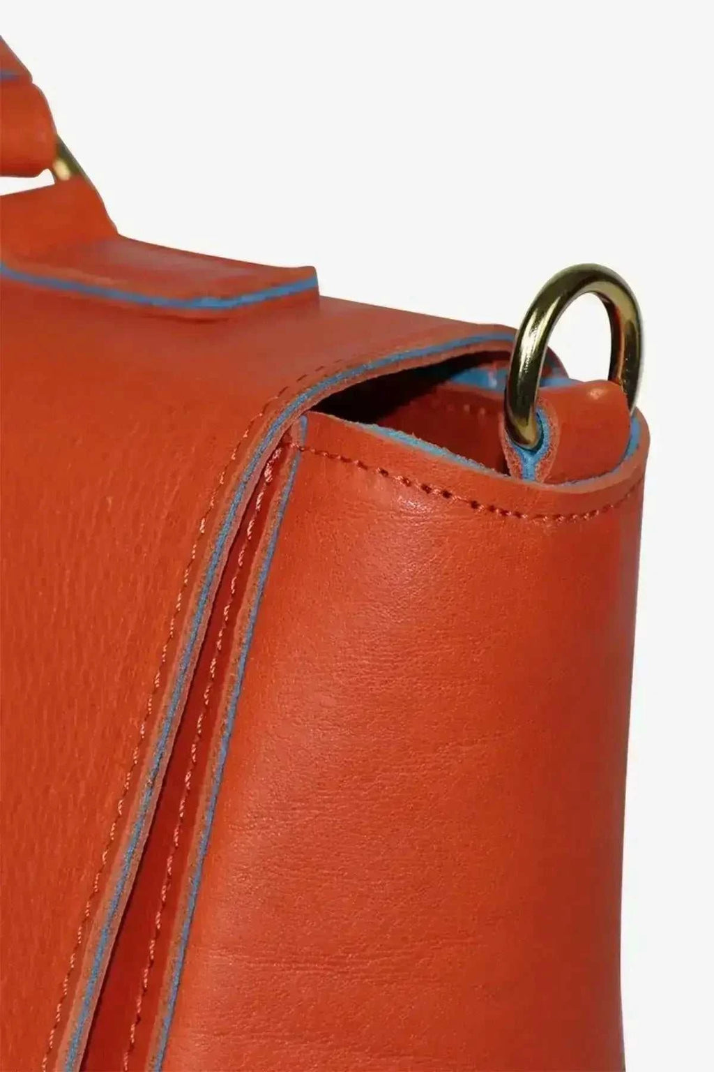 Elegant Handbag in vibrant orange vegetable tanned leather with gold metal hardware and blue edge detailing