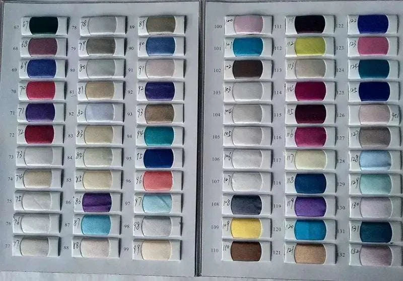 Elegant Lace Wedding Dress fabric color swatches featuring various shades including purples, blues, pinks, greens, whites, and neutrals in a sample book