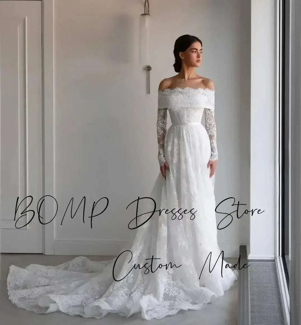 Elegant Lace Wedding Dress in ivory featuring off shoulder neckline, full lace sleeves, A-line silhouette, and long sweep train
