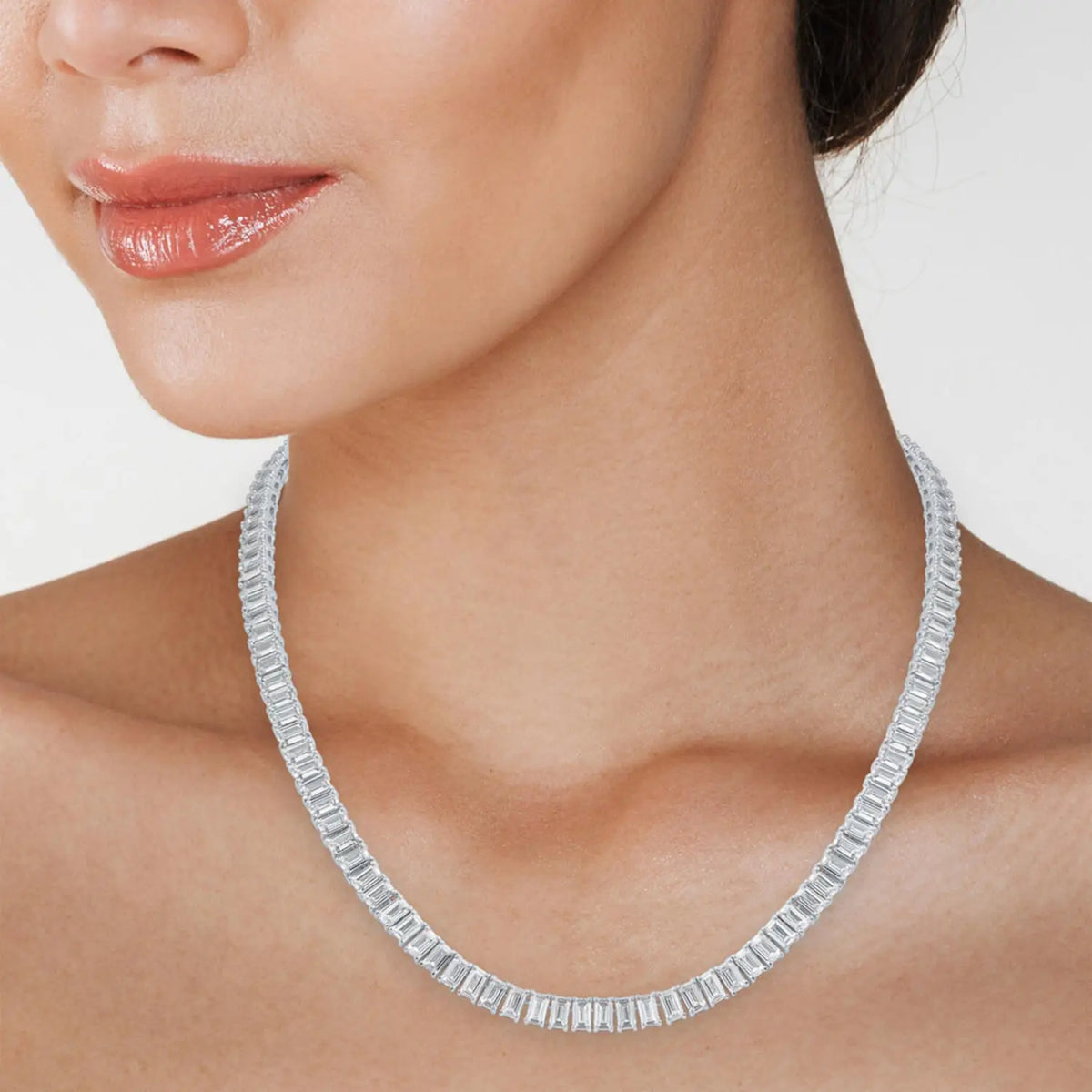 18 inch Emerald-Cut Created Moissanite tennis necklace with continuous baguette-cut stones in 14K white gold overlay