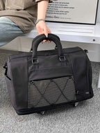 Expandable Rolling Duffel Bag in black Oxford cloth with front zippered pocket and sturdy top handles