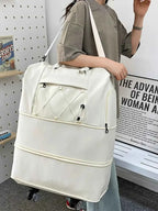 Expandable Rolling Duffel Bag in large white oxford cloth with multiple zippered compartments and wheels for easy transport