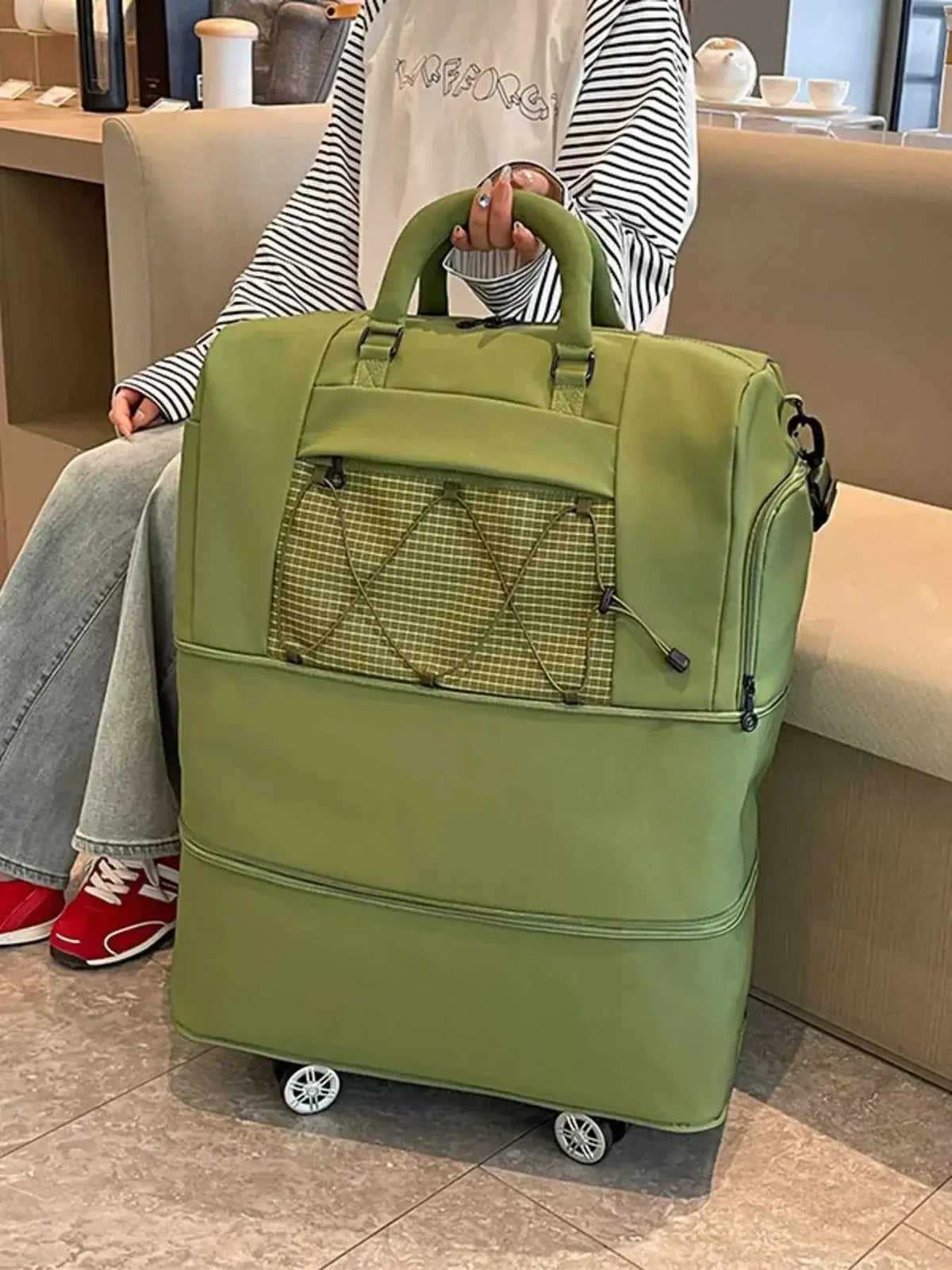 Expandable Rolling Duffel Bag in olive green oxford cloth with front mesh pocket and dual handles