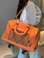 Expandable Rolling Duffel Bag in orange Oxford cloth with brown checkered front pocket and four black wheels
