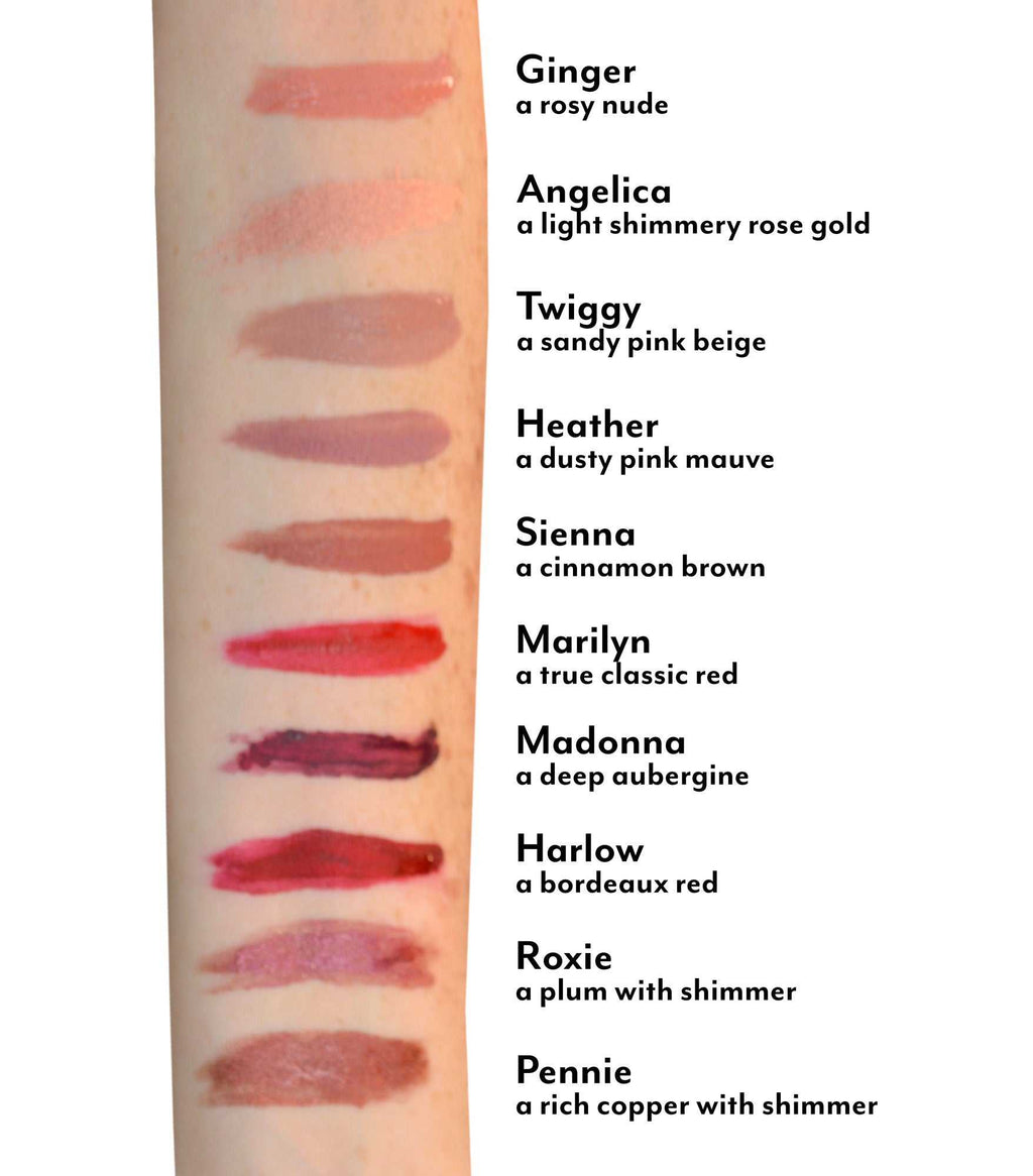 Farrah Stay Put matte lip cream swatches on arm showing ten shades including rosy nude, rose gold, dusty pink, cinnamon brown, classic red, aubergine, bordeaux red, plum with shimmer, and copper with shimmer