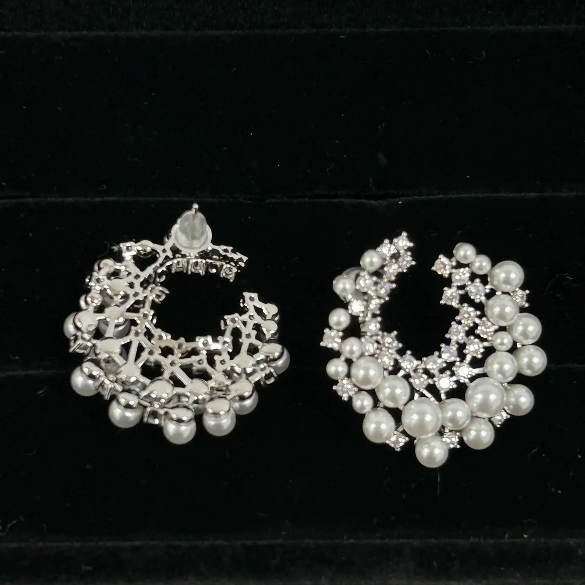 Silver-toned Firework Stud Earrings featuring intricate filigree design with embedded small pearls and cubic zirconia stones