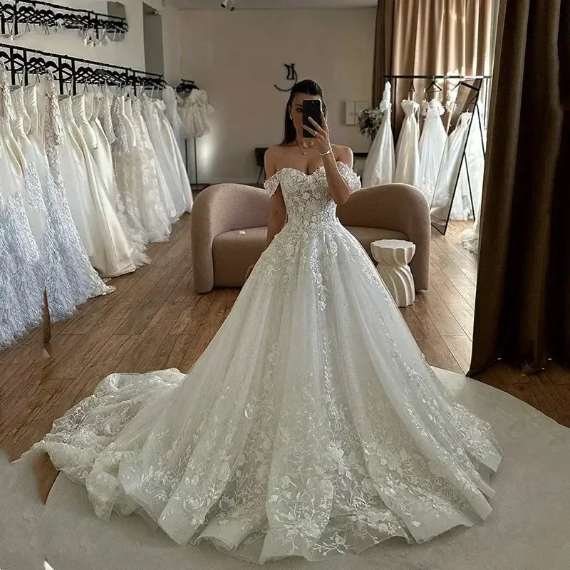 Flavinke Wedding Dresses off-shoulder sweetheart A-line ball gown wedding dress with lace appliques and a long train