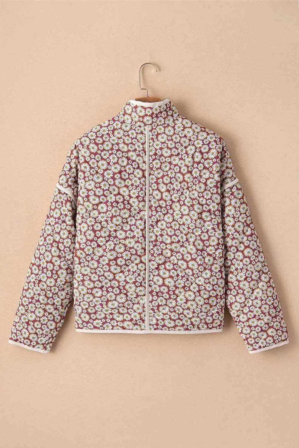 Floral Snap Down mock neck coat with white and pink daisy floral pattern on a red background, featuring a front zipper and long sleeves