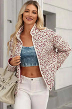 Floral Snap Down coat in red and white with daisy pattern, mock neck, long sleeves, and front pockets