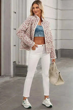 Floral Snap Down mock neck coat in white with red floral pattern, quilted polyester fabric, long sleeves, and pockets