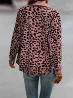 Full Size Leopard Print button-down jacket in pink and black with long sleeves and a relaxed fit, worn with jeans