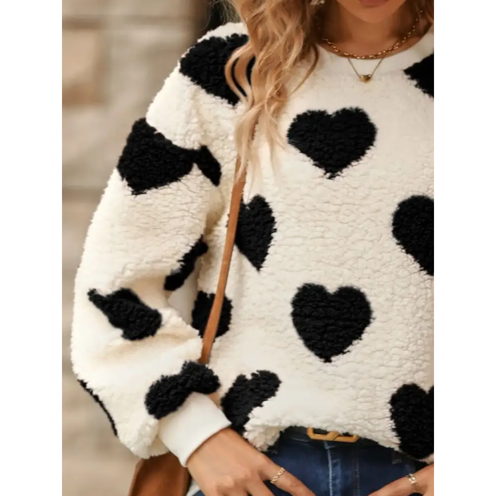 Fuzzy heart dropped shoulder sweatshirt in luxury fashion for women $27.99 embrace a basic yet effortlessly chic style