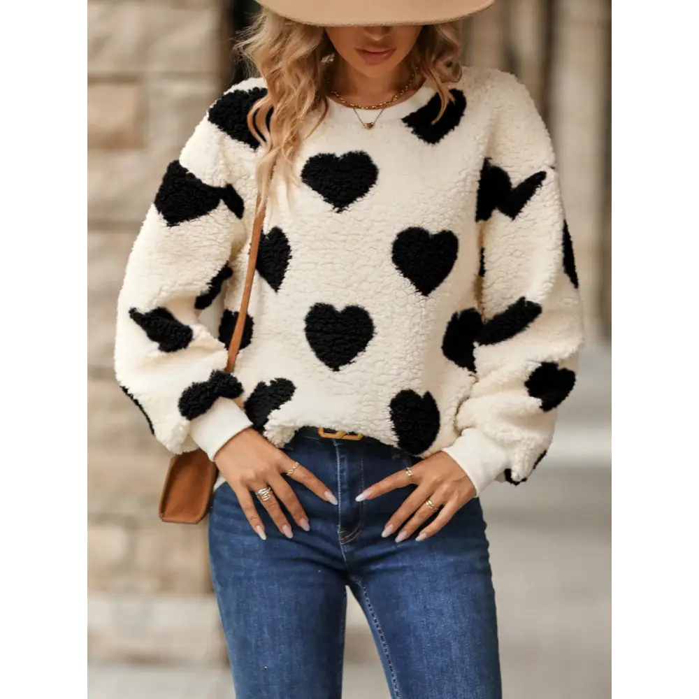 Fuzzy heart dropped shoulder sweatshirt in luxury fashion for women $27.99 embrace a basic yet effortlessly chic style