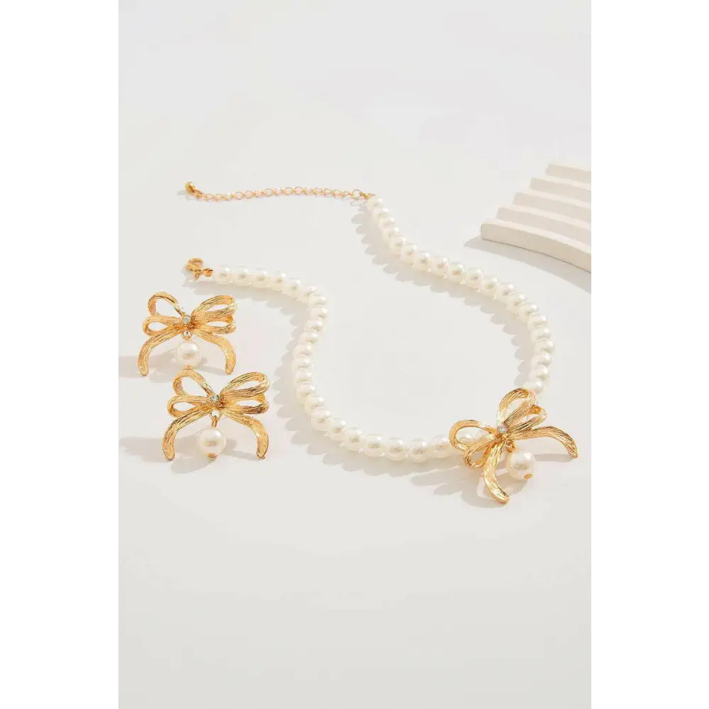 Elegant bow earrings with rhinestones and imitation pearls in luxury fashion $10.17 imitation pearl sparkling