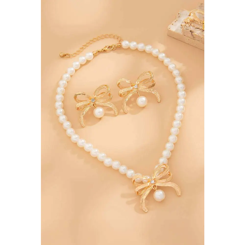 Elegant bow earrings with rhinestones and imitation pearls in luxury fashion $10.17 imitation pearl sparkling